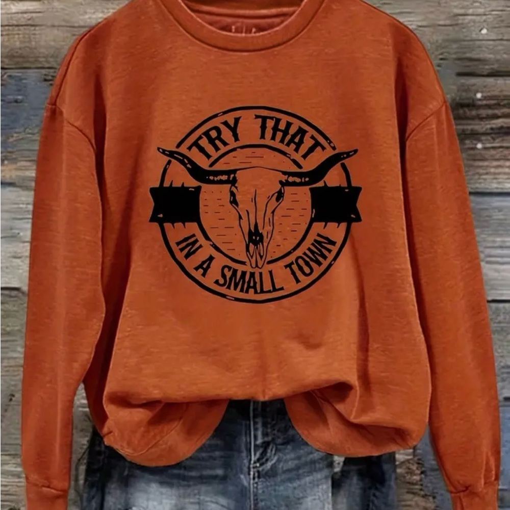 Women’s sweat shirt burnt orange size M.